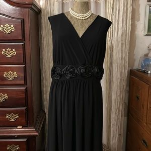 Black party dress with rosettes